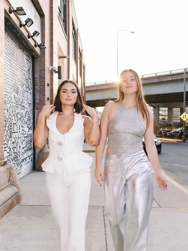 Two women in stylish outfits.